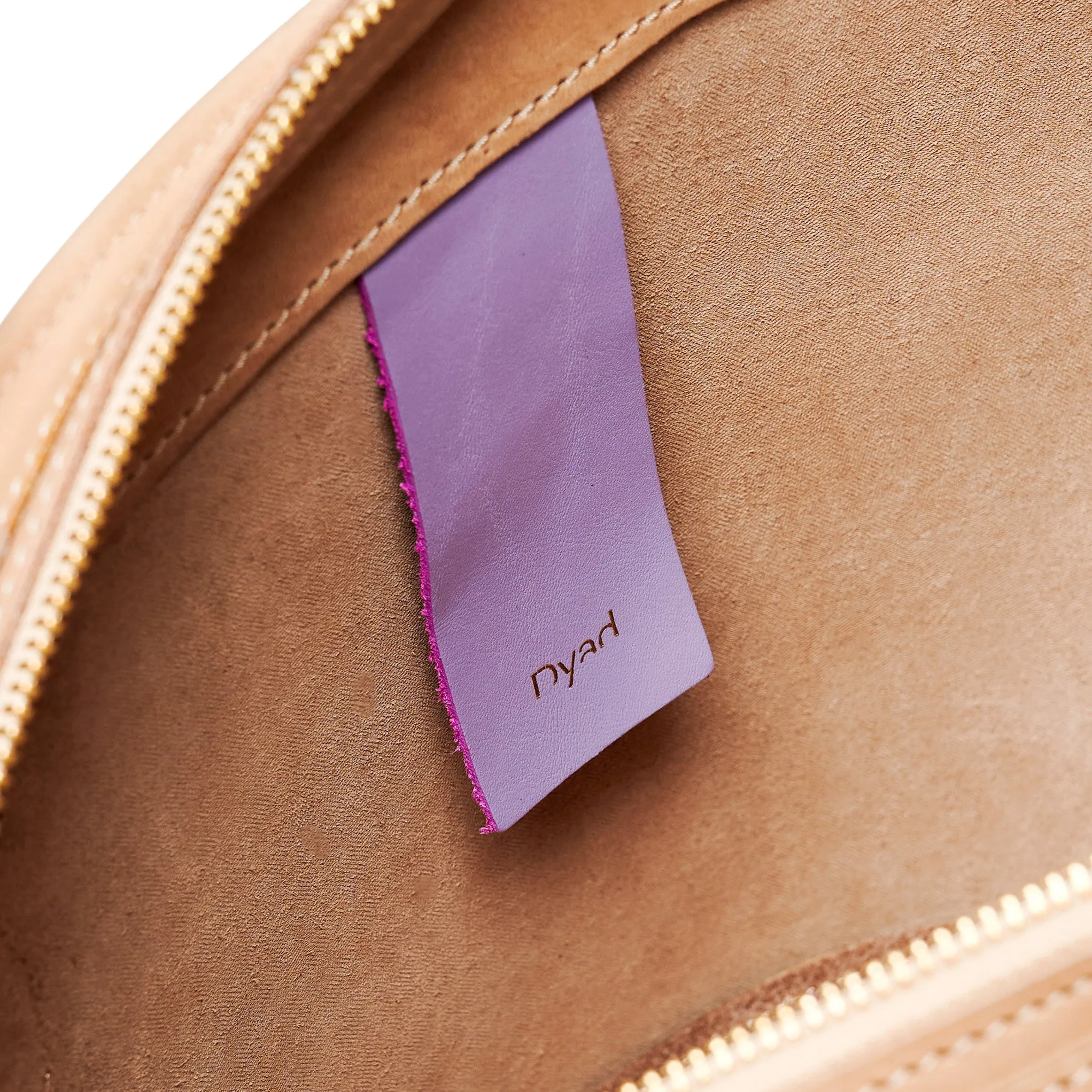 Project Dyad || Almond Color trapeze-shaped cow leather Inner small pocket Rope handle Emele Zipper Bag